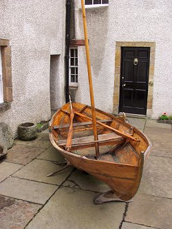 Picture of a boat outside of Orkney Museum